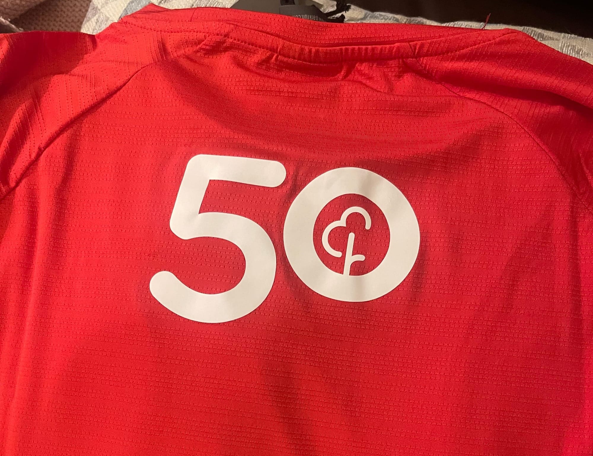 The number 50 on a parkrun t-shirt