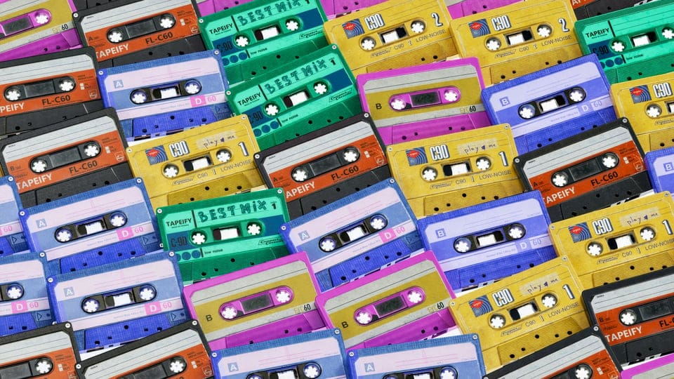 A range of different coloured cassette tapes.
